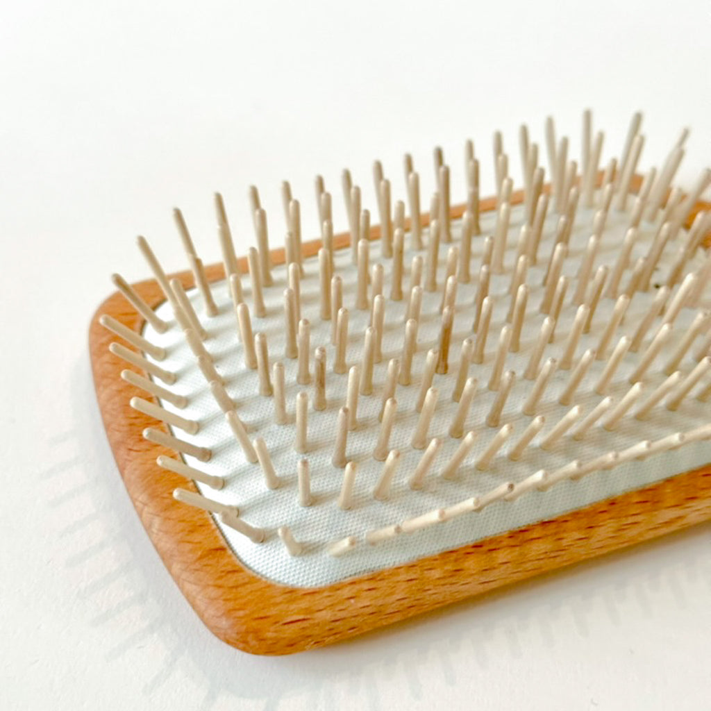 detail of wooden pins of donut brush