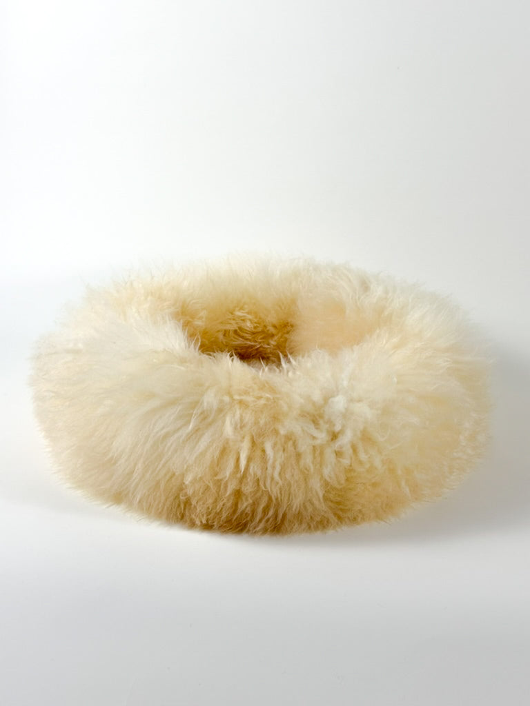 fluffy side view on empty sheep donut Dune Gold colour
