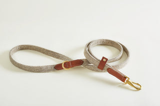 body lead in tweed colour Stone with brass details and italian leather