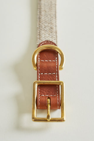 Brass trim detail of tweed and leather collar
