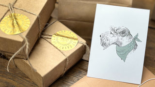 parcels  packes with a terrier postcard