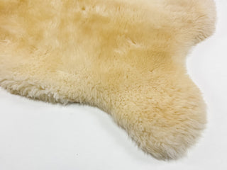 details of a sheep coat in soft colour creme