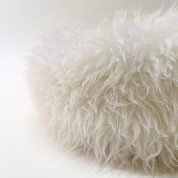 detail view of a creme sheep donut dog bed