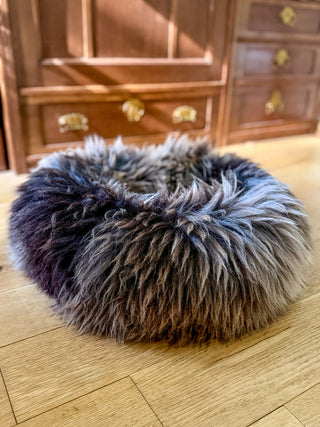Sheep Donut brown-grey in front of wardrobe