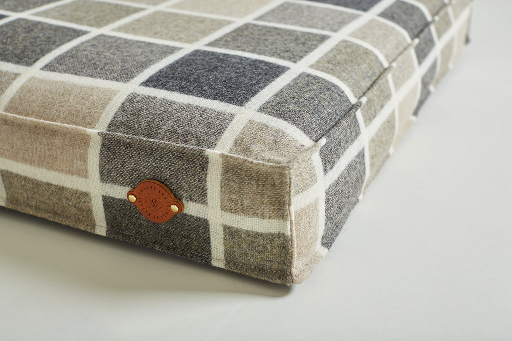 details of leather label on dog bed charcoal
