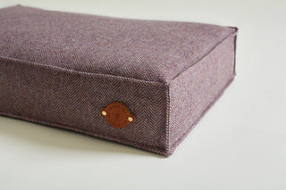 Details of dog bed tweed colour lavendar with leather label