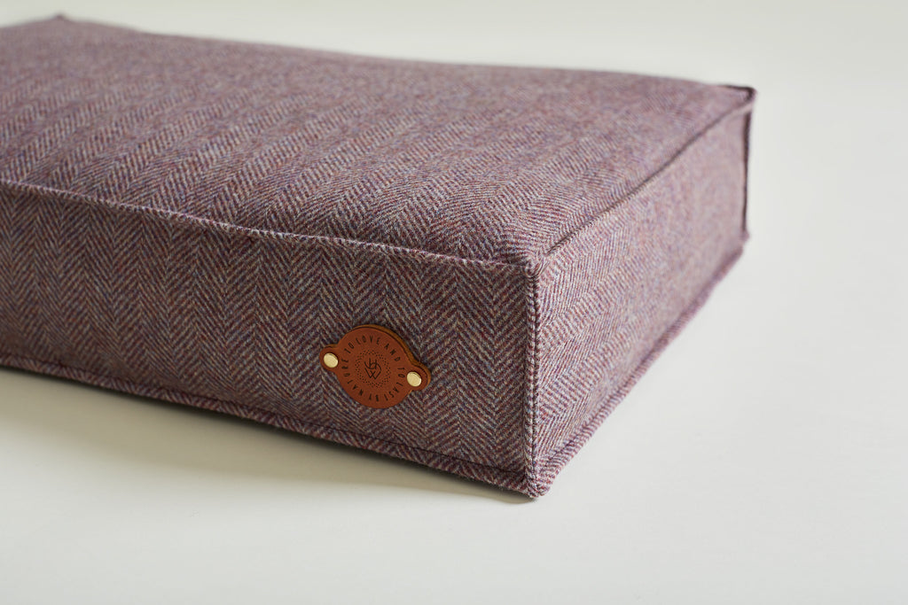 Details of dog bed tweed colour lavendar with leather label