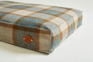 Details of leather label on tweed bed Kingfisher